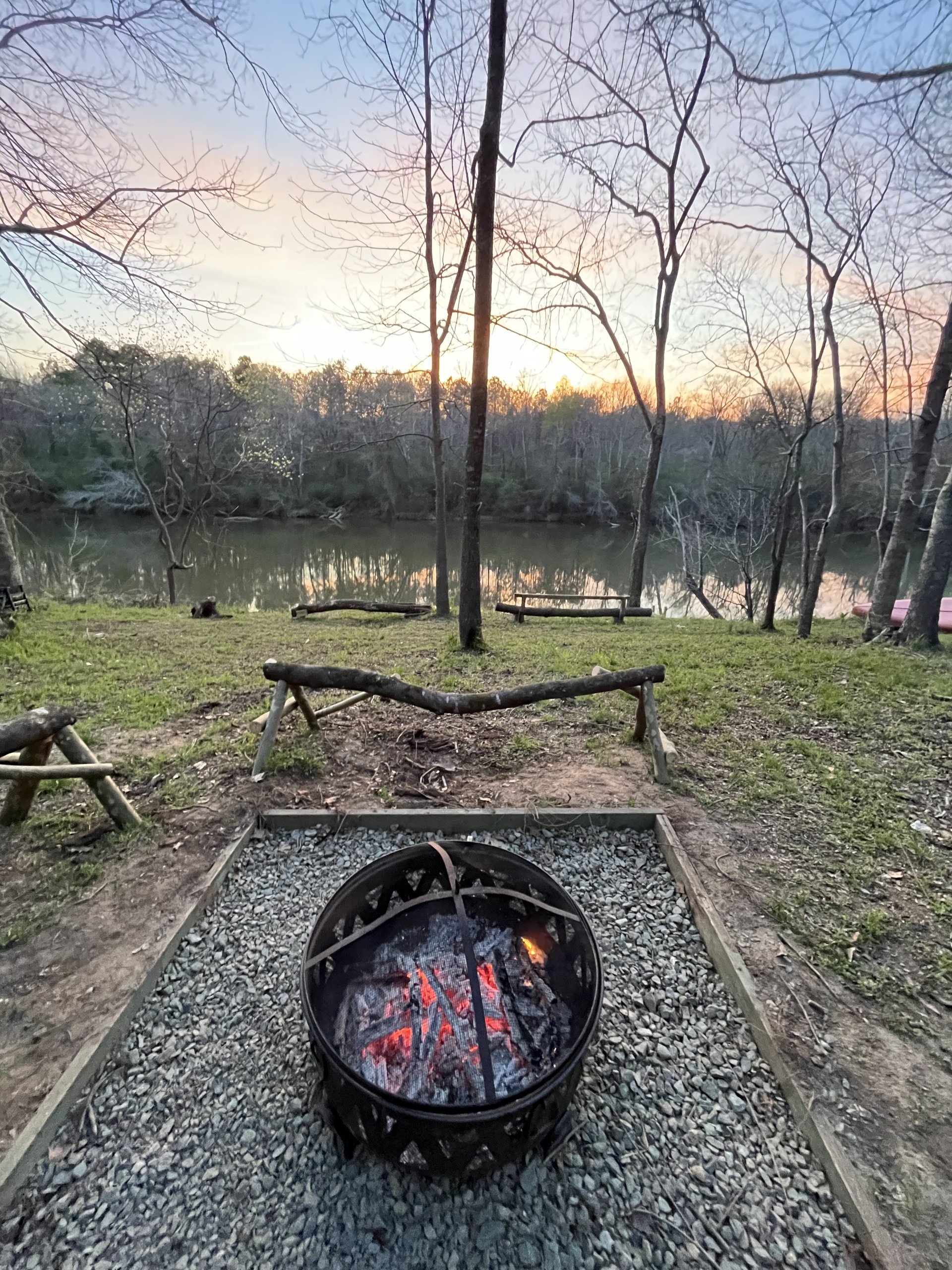 River fire pit at sunset
