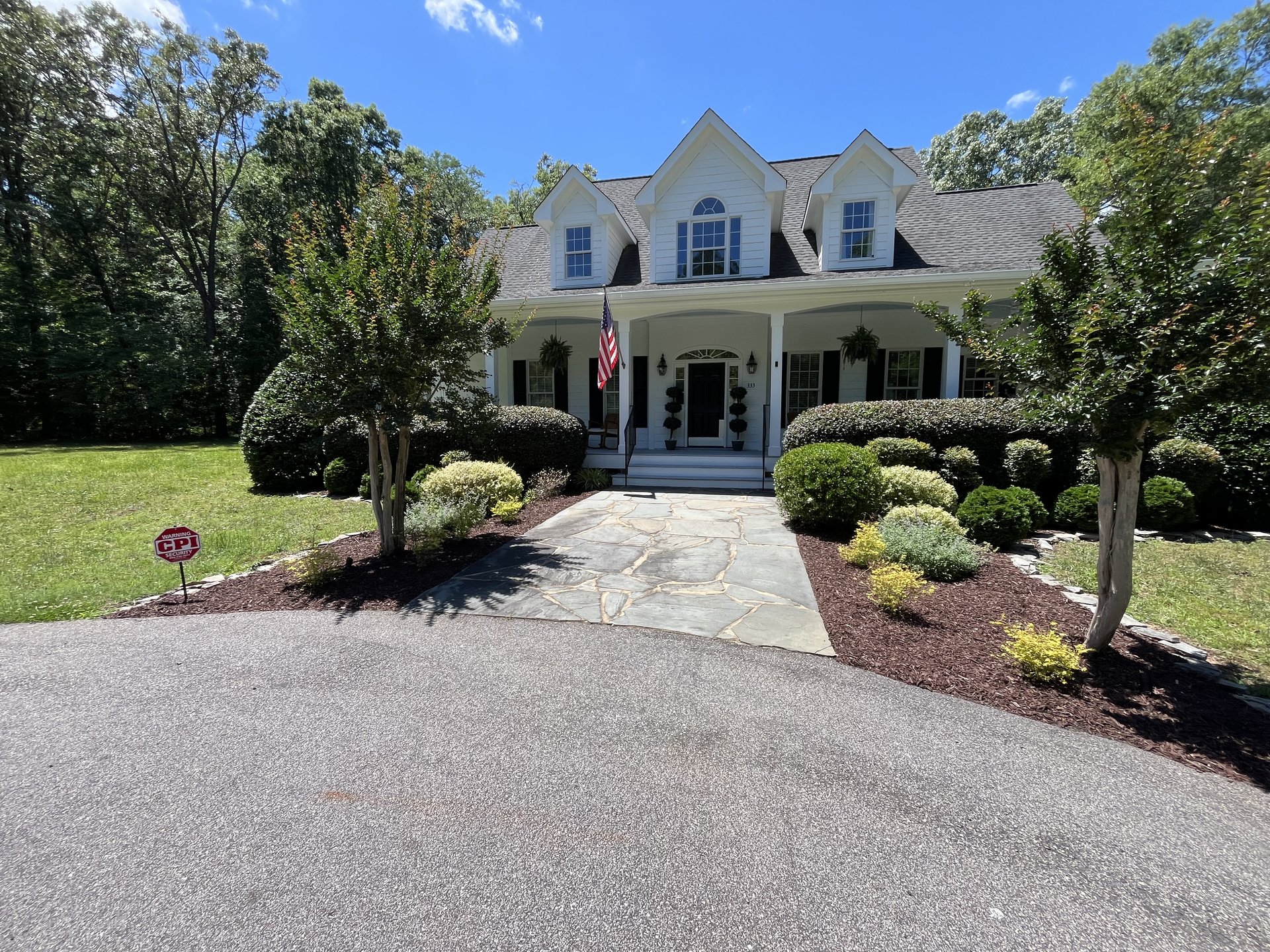 Front of The River House in summer