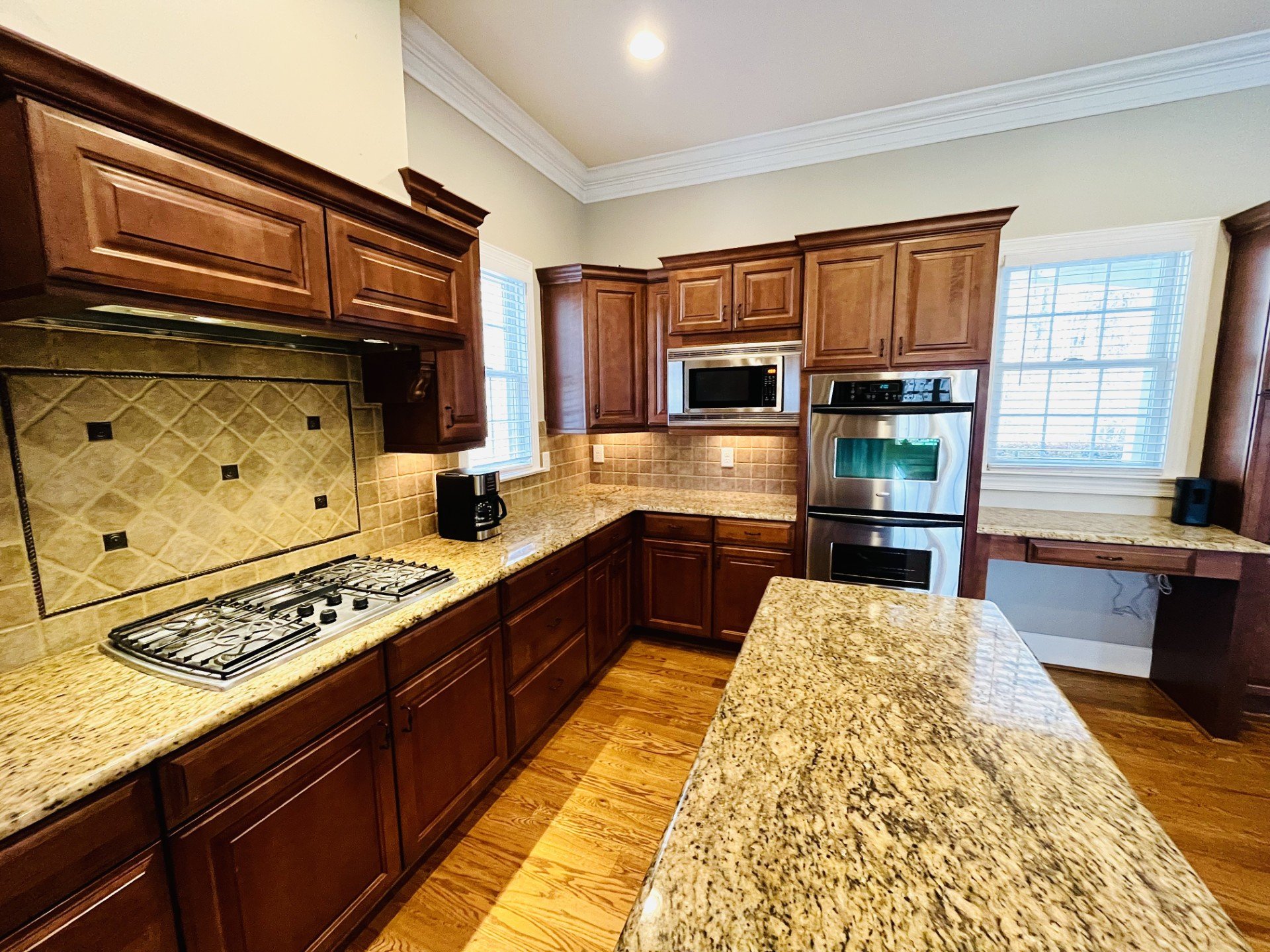 Gas range, double oven and granite countertops