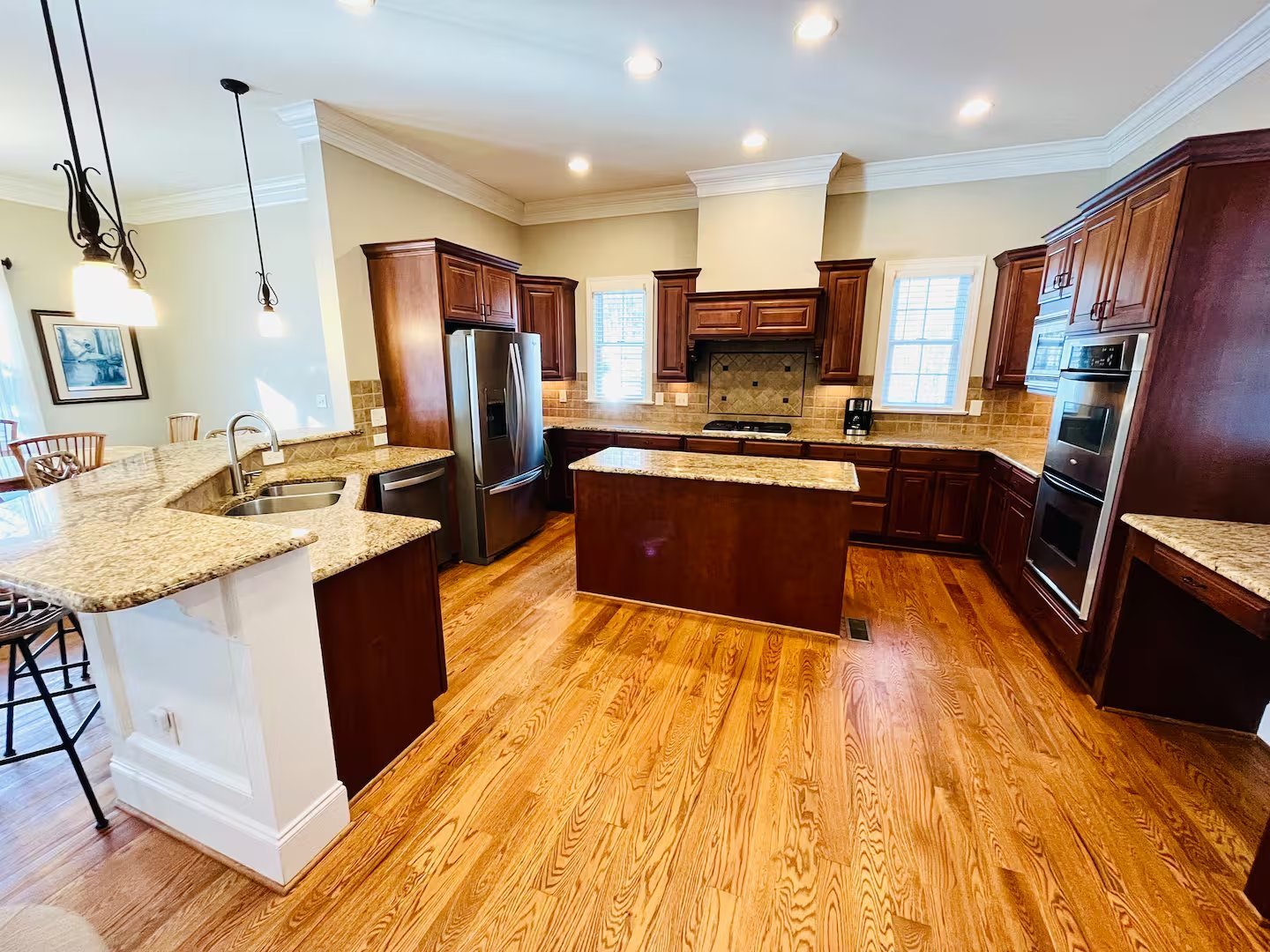 Full chef's kitchen with island and stainless appliances