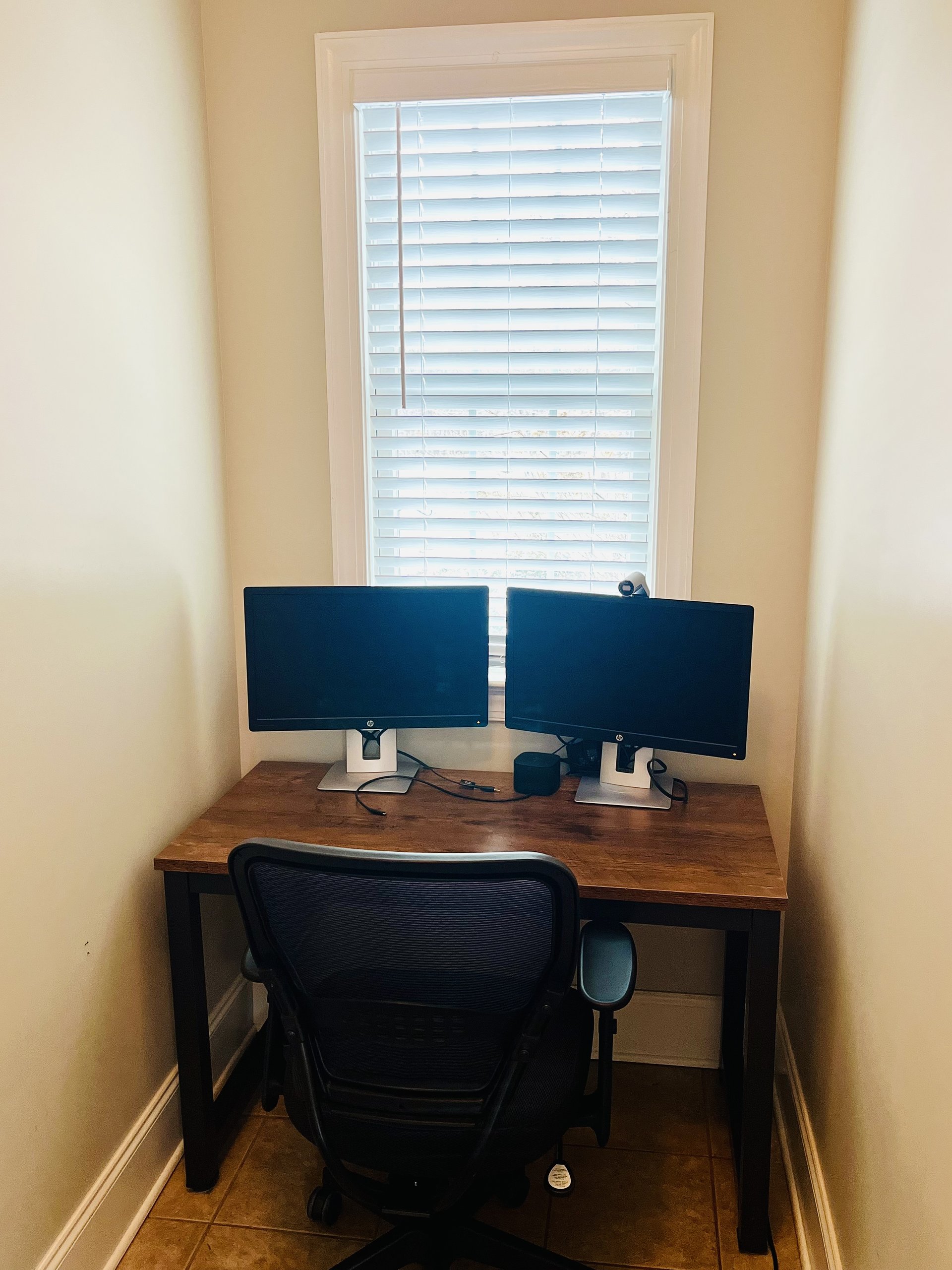 Private office with dual monitors and docking station
