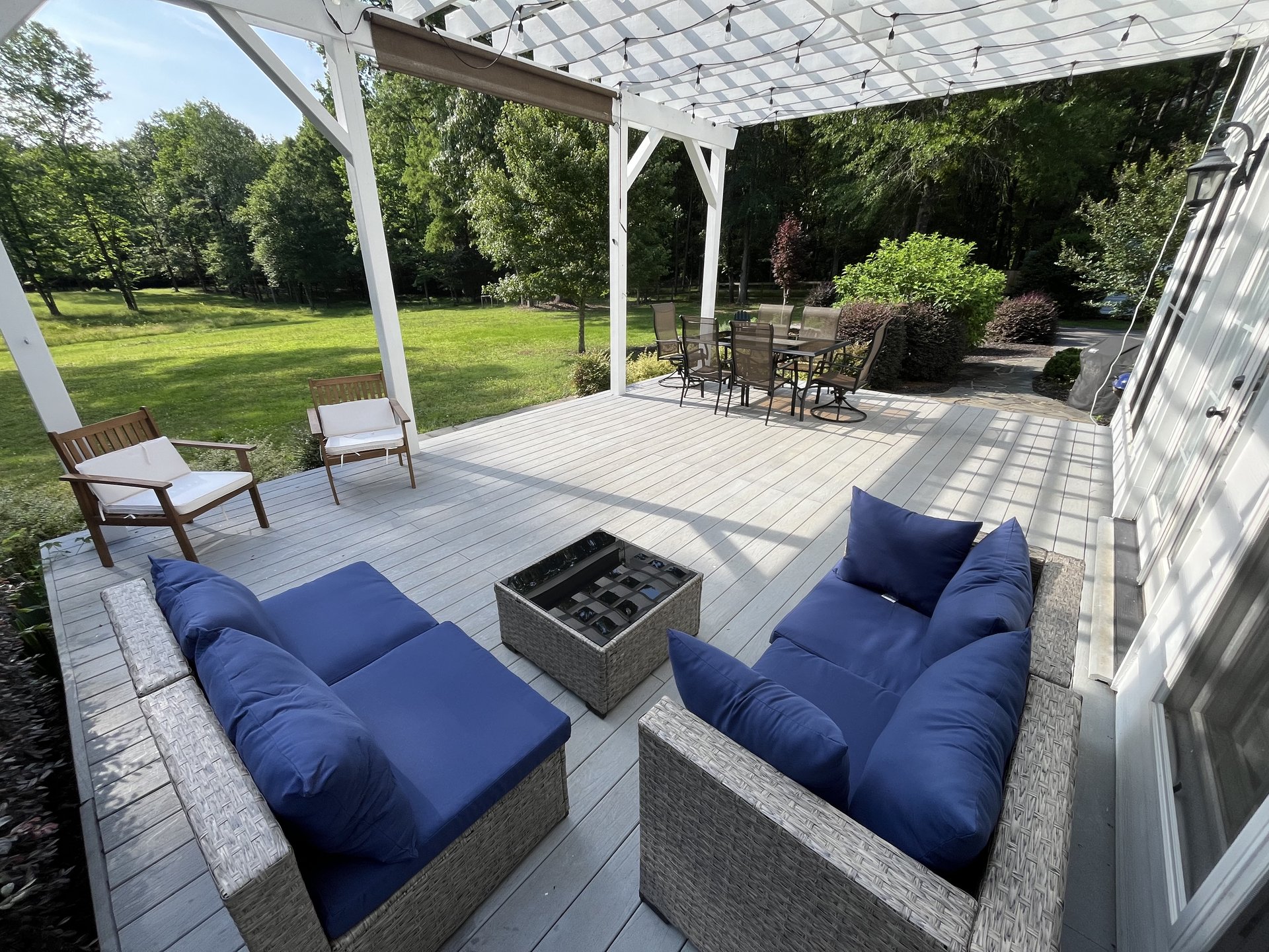 Pergola deck with blue lounge and dining